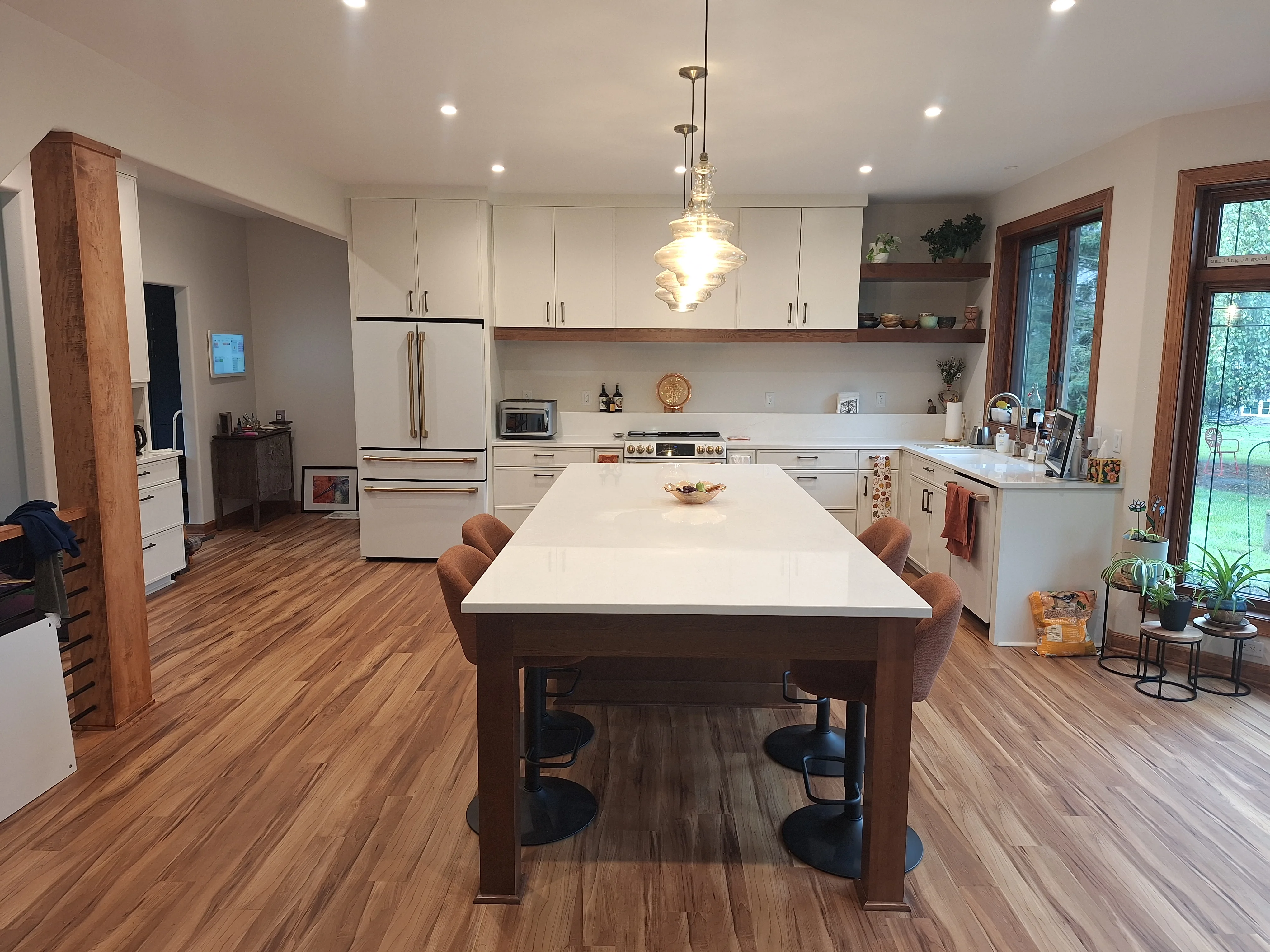 Bright kitchen remodel with white cabinets and a large island