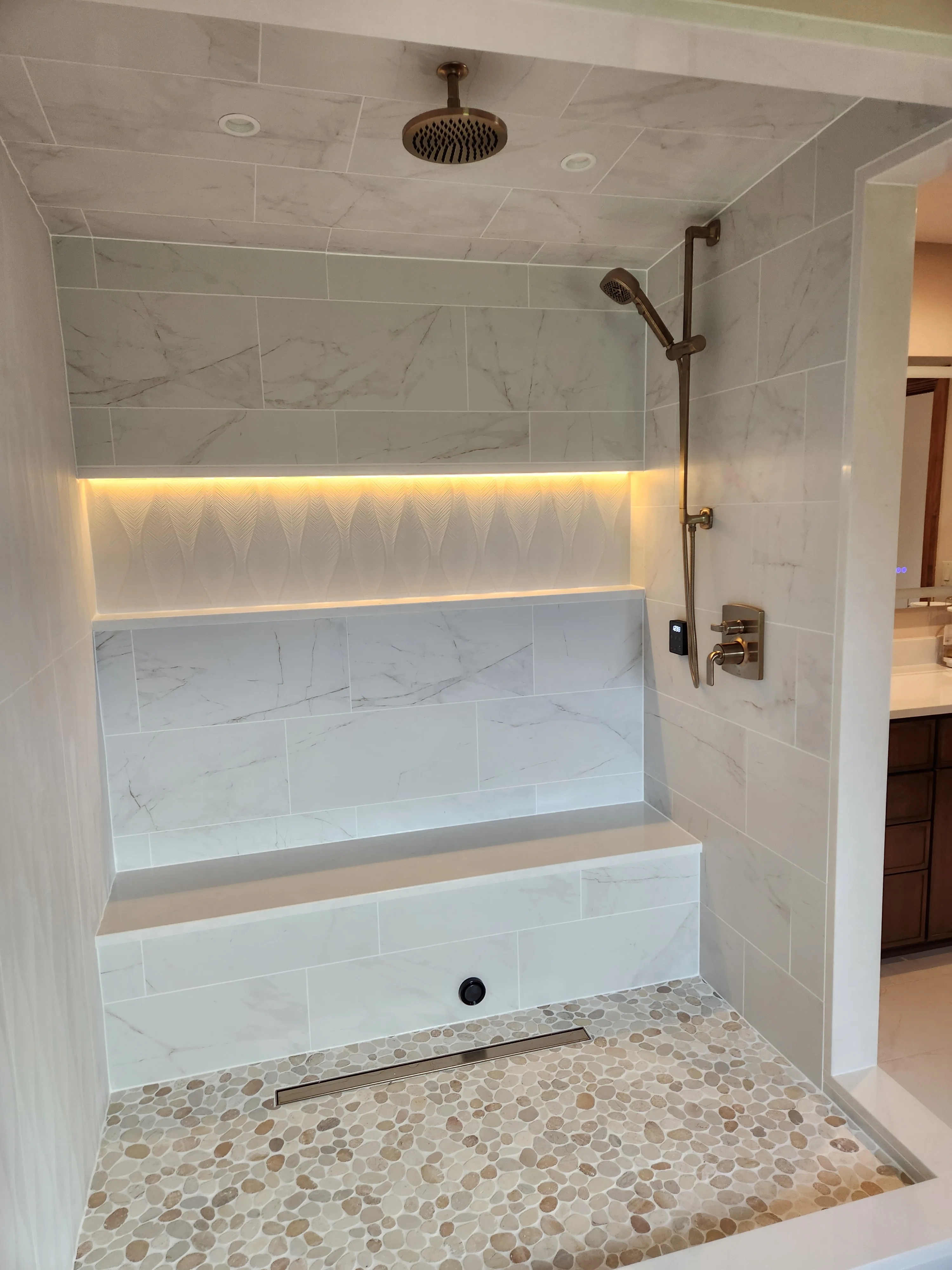 Custom tiled walk-in shower with dual showerheads